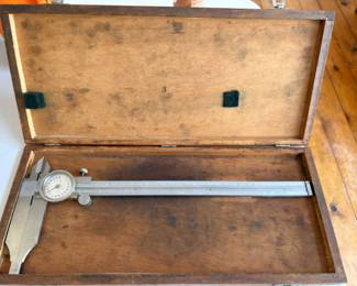 a collection of antique and vintage bone slide rules, tachometers, micrometers, calipers and calibration gauges