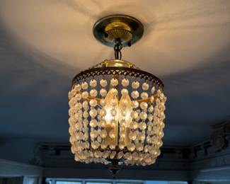 lots of vintage crystal and brass chandeliers and light fixtures for sale