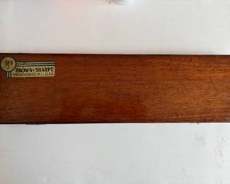 a collection of antique and vintage bone slide rules, tachometers, micrometers, calipers and calibration gauges