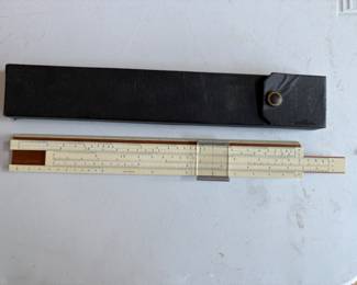 a collection of antique and vintage bone slide rules, tachometers, micrometers, calipers and calibration gauges
