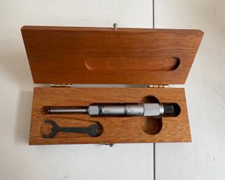 a collection of antique and vintage bone slide rules, tachometers, micrometers, calipers and calibration gauges