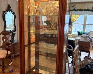 a vintage large lighted display cabinet