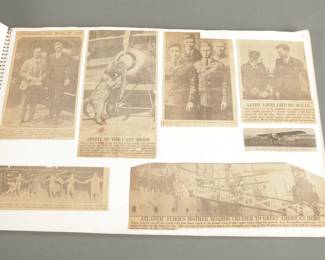 Charles Lindbergh Scrap Book & Hard Cover. Approximately 30 pages of early Newspaper articles and photos
