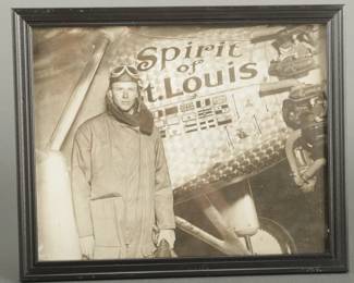 15 Photos of Lindbergh and Other Pilots. Also picture of Spirit of St. Louis. Original framed photo of Lindbergh next to his plane from February 17, 1928, and N.E.A. photo. Information on the back. Measures 10 3/4" x 8 3/4". 3 8" x 10" photos of Lindbergh (2 with wife). Two 1971 polaroids. 3 black and white uniform of other pilots. 3 photos of Lindbergh flying for Robertson Aircraft with one original negative. 4 alike photos with Lindbergh and other pilots with one original negative.