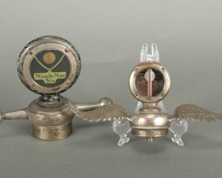 2 Moto Meter Automotive Mascots. Patent date on one is 1918. Has the Minute Man Six on the glass. It's from the Lexington Motor Co. Called the dog bone style