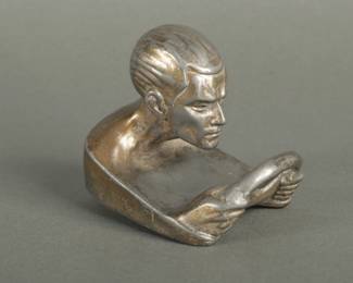 French Race Driver Hood Ornament. Measures 3 3/8" tall and 4" long. Signed by Leverrier