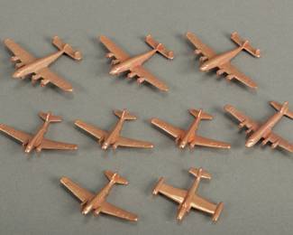 9 Copper Colored Metal Planes. 4 are DC3, 3 are C69, 1 is a DC6 and 1 is a jet. One C69 