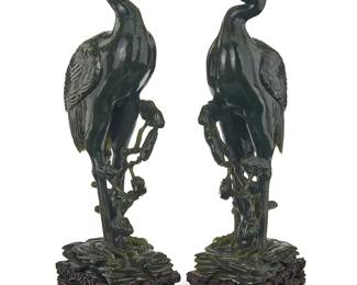 1032
A pair of Chinese carved nephrite and carnelian figures of cranes
Qing Dynasty (1644-1912) or later
Each set in a carved hardwood stand
2 pieces
Each figure: 14" H x 5.5" W x 3.5" D; Each overall: 15.75" H x 6" W x 4" D
Estimate: $2,500 - $3,500