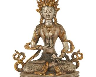 1062
A Tibeto-Chinese parcel gilt and silvered bronze figure of Vajra Tara
18th century or later
With impressed seal to baseplate
12.25" H x 9" W x 5.5" D
Estimate: $1,800 - $2,500