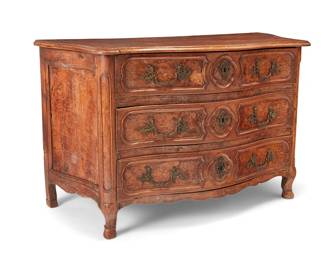 1239
A Louis XV Provincial burl walnut commode
18th century
The chest with three drawers, raised on front curved legs, featuring burlwood veneer to drawer fronts and side panels and figural brass pulls and lock escutcheons
37" H x 60.75" W x 27" D
Estimate: $700 - $900