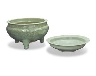 1025
Two Chinese Longquan celadon ceramic vessels
Yuan/Ming Dynasty (1271-1644) or later
Comprising a low bowl with impressed/incised floral decoration, and a crackle glazed tripod censer with floral motifs in relief
2 pieces
Bowl: 3.5" H x 13.75" Dia., irregular; Censer: 8.75" H x 14.75" Dia.
Estimate: $1,200 - $1,800