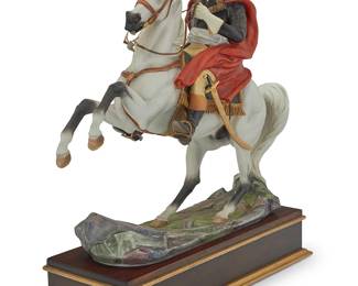 1210
A Royal Worcester bisque porcelain figure of Napoleon
Modeled by Bernard Winskill (n.d.-1980), mid/late 20th century
Printed factory marks and inscribed: NAPOLEON BONAPARTE / modelled by / B Winskill / © 1969 ROYAL WORCESTER
Polychrome and gilt, set in a parcel gilt wood base
Porcelain: 14.75" H x 15" W x 5.375" D; Base: 2.625" H x 14" W x 5.625" D
Estimate: $300 - $500
