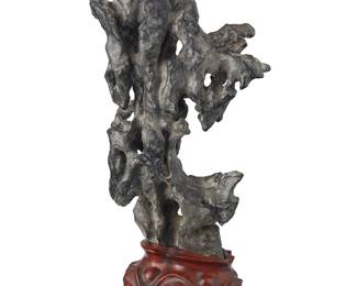 1094
A Chinese Ling Bi scholar stone
20th century
Mounted on a carved hardwood stand
Stone: 13.75" H x 7.5" W x 4" D; Overall: 16.75" H
Estimate: $1,500 - $2,000