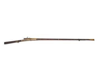 1131
An Indian 'torador' matchlock musket
Late 18th century
With wood stock and gilt-metal-mounted decoration throughout
69.25" L
Estimate: $700 - $900