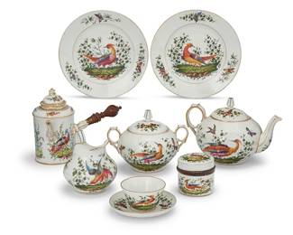 1212
A Chelsea style porcelain assembled tea service
Late 19th/early 20th century
All but saucers marked with gilt anchor cipher to underside
Comprising:
1 teapot (6.5" H x 9.5" W x 6.625" D)
1 chocolate pot (7.25" H x 8.75" W x 5.625" D)
1 cream pitcher (5" H x 5.5" W x 4.75" D)
1 lidded handled sugar (5.875" H x 7.75" W x 6" D)
1 lidded box (3.25" H x 3.625" Dia.)
12 teacups (3.625")
12 saucers (5.5")
17 luncheon plates (9.125")
45 pieces
Estimate: $600 - $800