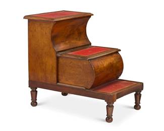 1171
A set of English leather inset wood library steps
19th century
With paper tag applied to top lid interior: Miller & Sons, / Furniture Brokers, / Thame, Oxon.
The second and third gilt tooled leather treads as hinged lids opening to reveal storage, raised on turned legs
25.25" H x 26.75" W x 18.5" D
Estimate: $300 - $500