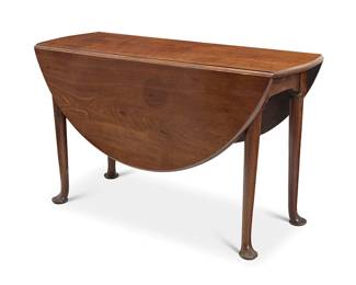 1166
A George I style gateleg table
Late 19th/early 20th century
The oval table with gate legs ending in pad feet
Stored: 28.5" H x 48.5" W x 17.75" D; Open: 51.25" D
Estimate: $700 - $900