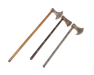 1129
Three Indo-Persian battle axes
18th/19th century
Comprising one with incised metal handle and gilt decorated blade (24.75" L, blade 4.75" L), one with gilt-mounted wood handle and gilt-decorated blade (24.75" L, blade 3.25" L), and another with wood handle (33.25" L, blade 5.5" L)
3 pieces
Estimate: $600 - $800