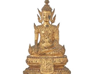 1082
A Burmo-Thai gilt metal Buddha figure
Rattanakosin Period (1782-1932)
With inset glass accents, depicted with hands in bhumisparsha mudra, seated on a tiered base
11.75" H x 7.375" W x 5" D
Estimate: $600 - $800