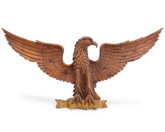 1200
A Folk Art carved wood eagle
20th century
With gilding to base
30.5" H x 59" W x 7" D approximately
Estimate: $700 - $900