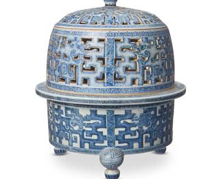 1153
A Chinese blue and white porcelain tripod censer
Republic Era (1912-1949) or earlier
Unmarked
The three-part footed censer with reticulated lid and midsection, decorated with meandering and figural motifs
11.75" H x 9.75" Dia.
Estimate: $3,000 - $5,000