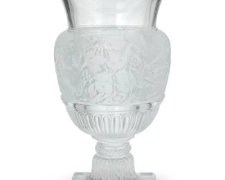 1275
A Lalique glass 'Versailles' vase
Late 20th century
Etched: Lalique ® France
The clear and frosted glass urn-form vase with square foot
13.75" H x 9.375" Dia.
Estimate: $1,000 - $1,500