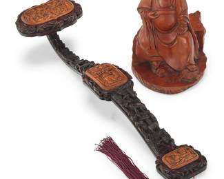 1030
Two Chinese carved wood table items
20th century
Comprising a carved boxwood seated Luohan figure and an intricately carved Ruyi scepter with fabric tassel
2 pieces
Luohan: 7.875" H x 5.75" W x 6.125" D; Ruyi: 19.5" H x 5" W x 3.5" D
Estimate: $600 - $900