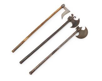 1130
Three Indo-Persian battle axes
18th/19th century
Comprising one with a bird-form accent at top and gilt decorations to blunt side (26.625" L, blade 5.25" L), one with an incised inscription and foliate motifs impressed (25.5" L, blade 5.375" L), and another with later wood handle (26.5" L, blade 4.875" L)
3 pieces
Estimate: $400 - $600