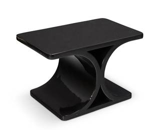 1316
A Karl Springer style lacquered wood side table
Late 20th century
Unmarked
In the style of the 'JMF' table designed by Karl Springer (1931-1991), the hourglass-form table constructed of formed black lacquered wood
18.25" H x 28.5" W x 18.25" D
Estimate: $200 - $300
