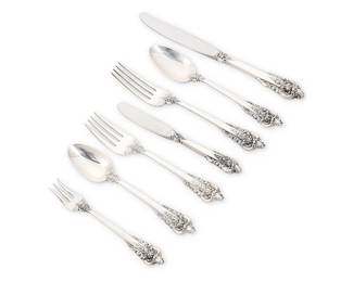 1016
A Wallace sterling silver 'Grand Baroque' flatware service
Mid/late 20th century
Each marked for sterling and with factory marks
Comprising:
12 dinner knives (9")
12 butter spreaders (6.375")
10 dinner forks (7.625")
10 salad forks (6.375")
10 cocktail forks (5.375")
10 teaspoons (6.25")
10 oval soup spoons (7")
74 pieces
Total weighable sterling: 74 oz. troy approximately
Estimate: $2,000 - $3,000