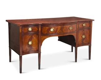 1173
A George III inlaid mahogany sideboard
Early 19th century
With four drawers centering a locking middle drawer with fitted interior, decorated with marquetry shell-form accents
38.25" H x 72.75" W x 31.5" D
Estimate: $700 - $900