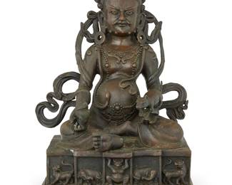 1296
An Asian bronze figure of Jambhala
19th Century; Tibet or South Asia
With inscription to base verso; impressed seal to baseplate
12" H x 8" W x 6.5" D
Estimate: $800 - $1,200