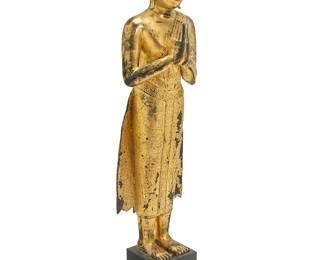 1086
A Southeast Asian gilt metal standing Buddha
19th/20th century, likely Thailand
Painted and gilt, with hands in Wai position, mounted on a wood plinth
Figure: 49" H x 14.5" W x 11" D; Overall: 58" H
Estimate: $1,000 - $1,500