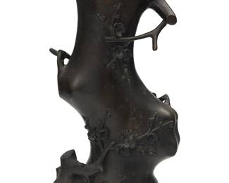 1058
A Japanese bronze branch form vase
20th century
Unmarked
Depicting cherry blossom branches
15" H x 8.5" W x 5.375" D
Estimate: $300 - $500