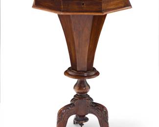 1140
A Regency burl walnut work table
Early 19th century
The locking hinged top opening to reveal a fitted interior later lined in paper, raised on a carved tripod base with scrolled feet
27.5" H x 16" W x 16" D
Estimate: $400 - $600