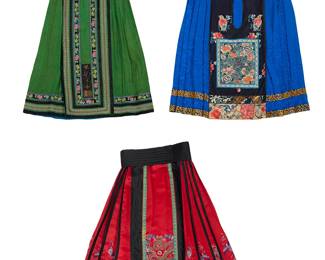 1049
A group of Chinese embroidered silk skirts
Qing Dynasty (1644–1912) or later
Comprising three silk skirts, each with pleated sides and decorative polychrome embroidery and brocade ribbon trim to front and back panels and hem:

A green silk damask side zip skirt with floral embroidered banding and passementerie trim with a blue silk lining
37" H x 16" W at front waist

A red and black silk satin front-wrap skirt with various embroidered dragons, pheasants, bats and deep water motifs and a blue silk lining and a pleated black silk cummerbund-style belt
2 pieces
Skirt: 34" H x 17" W at front waist; Belt: 4" H x 39.5" W

A bright blue silk damask side zip skirt with large embroidered floral panels on navy blue silk, with auspicious characters such as bats and melons, and trimmed with bands of floral chenille embroidery
36" H x 20" W at front waist

4 pieces total
Estimate: $1,500 - $2,000