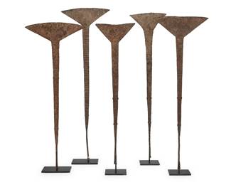 1092
A group of African Idoma 'akika' iron currency
Late 19th/20th century; Nigeria
Each hammered iron, mounted to an enameled metal stand
5 pieces
Tallest: 31.25" H x 10" W; Shortest: 26.25" H x 7.5" W
Estimate: $300 - $500