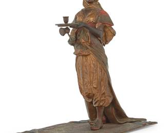 1255
A Viennese cold painted bronze figure of a maiden
Early 20th century
Unmarked
Depicted standing on a Persian rug
9.25" H x 8" W x 5" D
Estimate: $400 - $600