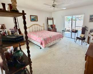 Master bedroom queen bed… Several handmade quilts… 1950s Oak furniture… Major collectibles