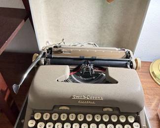 Early electric typewriter in case
