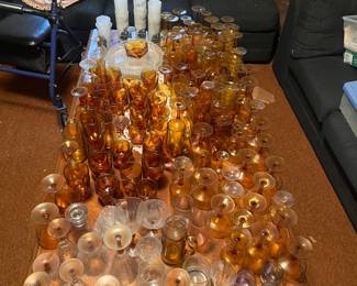 Large wood coffee table with glassware plus couch