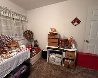 boxes of blank cards, fans, vintage red suitcase