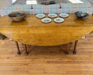 antique Queen Anne style oak drop leaf wake/hunt table with pad feet