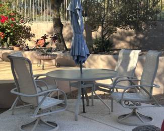 Outdoor four piece dining room set with umbrella