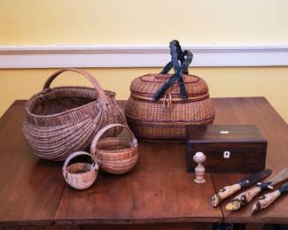 Baskets, coquilla nut pin cushion and deer foot paper knives, 19th century. 