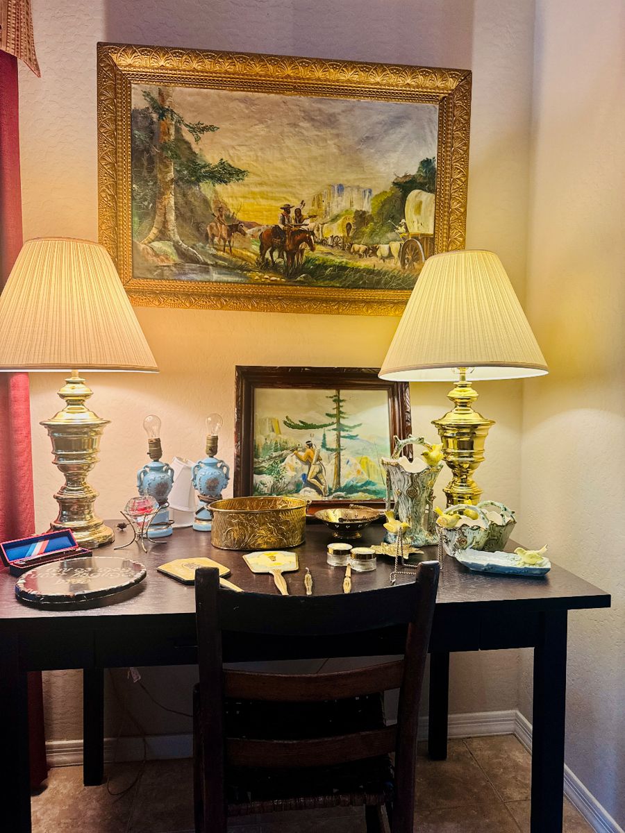 This is a warm & really charming Western / pioneer-era vignette, and there are multiple sellable pieces here. Featuring original art, brass lamps, and vintage pieces on an Espresso desk.