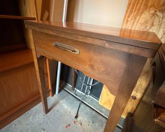 Vintage Sewing Machine in Cabinet
Mid-century wood cabinet with fold-down sewing machine. Classic furniture-style design.