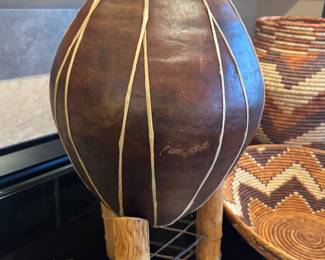 Handcrafted Southwestern earthenware pottery vessel with applied clay detailing, displayed on a carved wooden stand. Rustic desert aesthetic—perfect accent for Southwest, boho, or organic modern interiors.