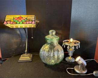 A Couple Lamps And A Glass Jar