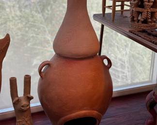 Folk art candelabra (left) chimenea (center) misc. folk art sculpture (right)